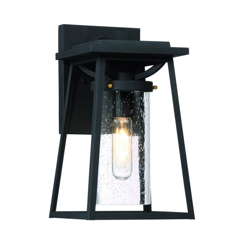 Lanister Collection 1-Light Outdoor Wall Mount Lantern in Sand Black with Gold Accents and Seeded Clear Glass Panels Minka-Lavery 72712-66G Available in 5”, 7”
